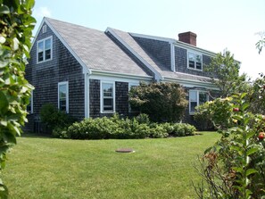 Professionally landscaped with native plants and shrubs with an irrigated lawn 
