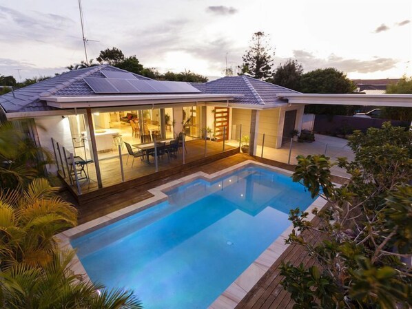 Fabulous pool - kitchen, living area leading onto deck .See the kids in the pool