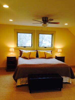 King size bed with fan above.