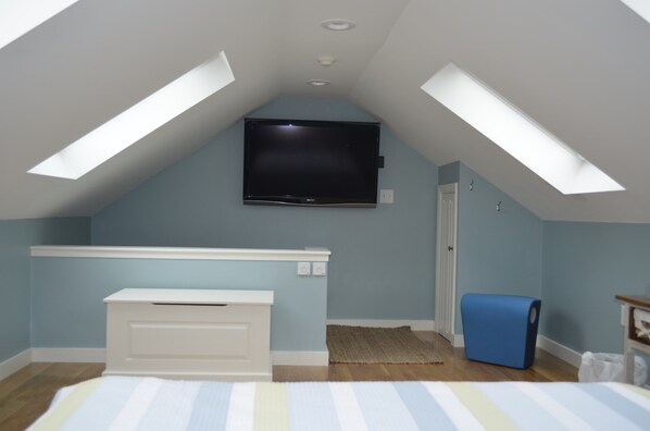 Upstairs loft bedroom, one queen size bed, large screen t.v.