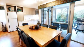 Dining, kitchen and balcony