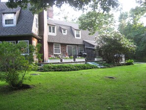 Deck located off kitchen with seating and grill