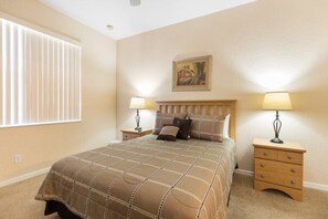Cozy bedroom with warm lighting for a restful night’s sleep.