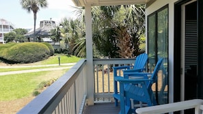 Enjoy your porch and a view of the tropical landscape.