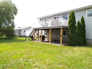 back yard view with gas grill on lower patio 