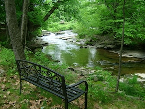 Bench by the stream