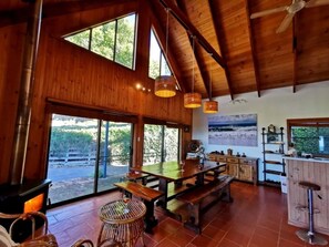 A gorgeous high-ceiling living and dining area that wows upon entry. 