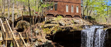 House with stairs to lower deck and your own private waterfall