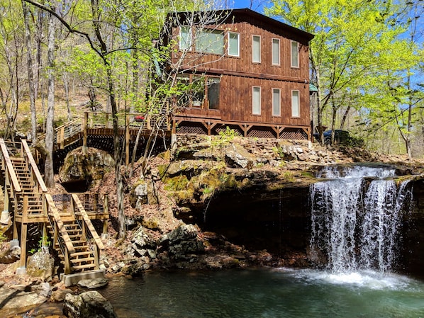 House with stairs to lower deck and your own private waterfall