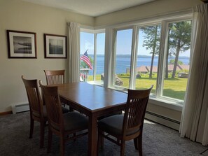 Dining table seats 8 with a bench on one side and 2  extra chairs stored in unit