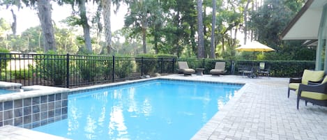 Sunny pool with plentiful and comfortable seating