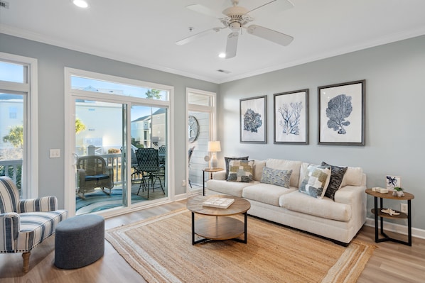 Cozy living room with access to screened in patio.