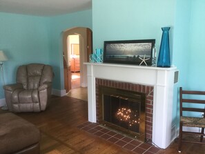 Cozy fireplace lite up with white lights