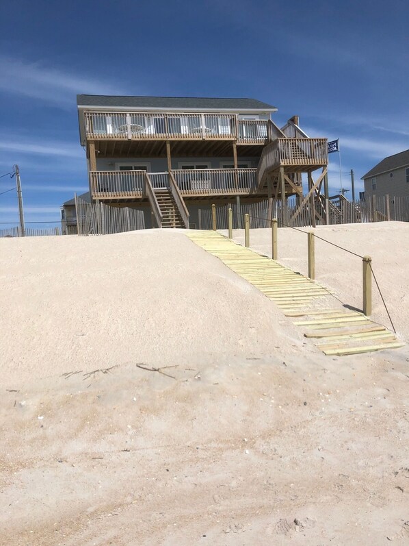 View from the beach up the private walkway to the oceanside decks