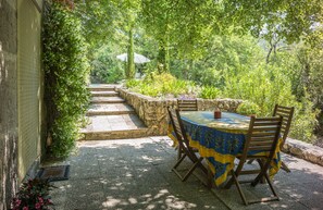 Shaded terrace overlooking brook
