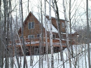 Hill side home in the winter.