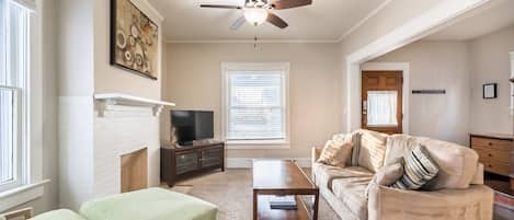 Living Room w/ sleeper sofa and smart TV with Roku.