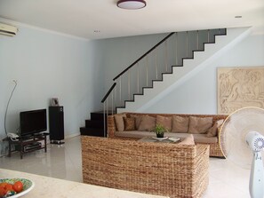 Stairs up to main bedroom and deck.