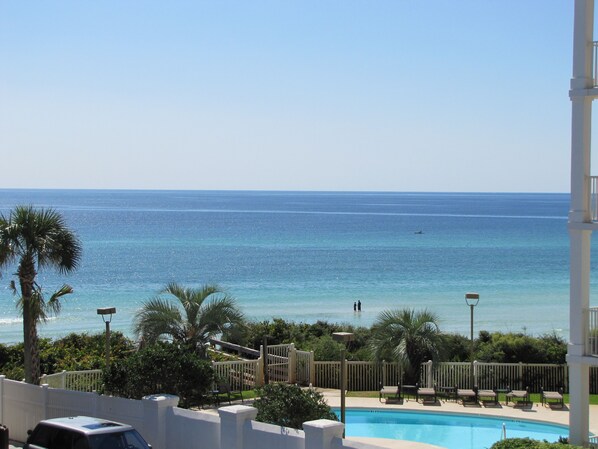 View across the pool to the Gulf from the 2 decks of this 3 story,1850 sqft home