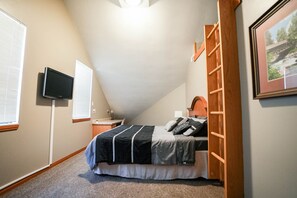 Master bedroom with king sized bed and TV with Chromecast.