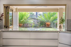 Six Beachside Port Douglas:  Huge Kitchen opens up to outdoor dining area