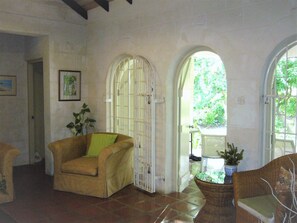 Living room view out to veranda. Master bedroom door to the left.