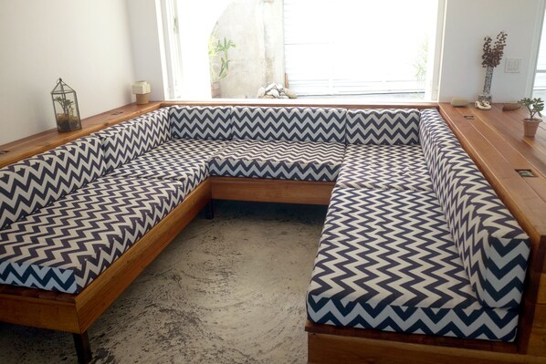 Custom built 9' X 9' built in sofa.  Sofa  can double as x2 twin beds. 
