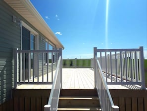 Access deck from 3 points - the side stairs, patio doors, and screen room