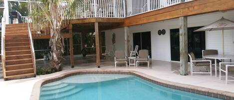 Pool lanai area with shallow seating, screened and private