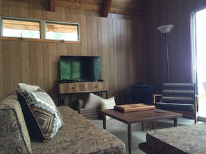 The living room with comfy seating for 6 or more and 2 day beds