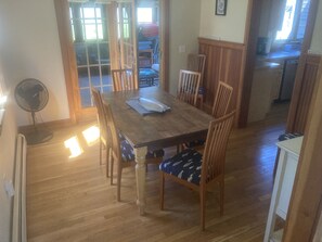 Dining room with doors to 3 season room. 