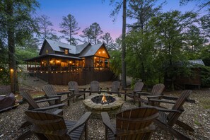 Grand fire pit with Adirondack chairs!