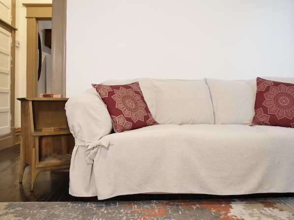 Comfortable 3-Seat Sleeper Sofa in spacious living-room. 