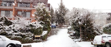 Front of apartment block during a snow storm