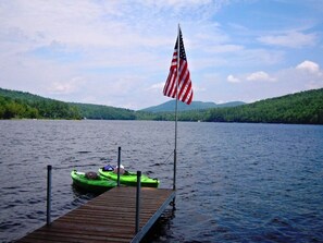 Dock with two kayaks and canoe