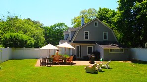 Backyard - enclosed garden with patio furniture and barbecue 