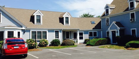 The front of the building with the 2 parking spots.