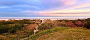 Sunset from the garden with private beach access