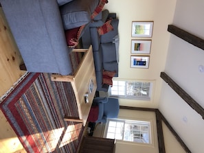 There is plenty of seating and a large custom coffee table in the family room