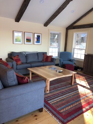There is plenty of seating and a large custom coffee table in the family room