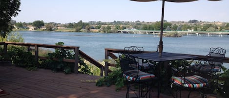 Relaxing dining or cocktails on our porch overlooking the Snake River.