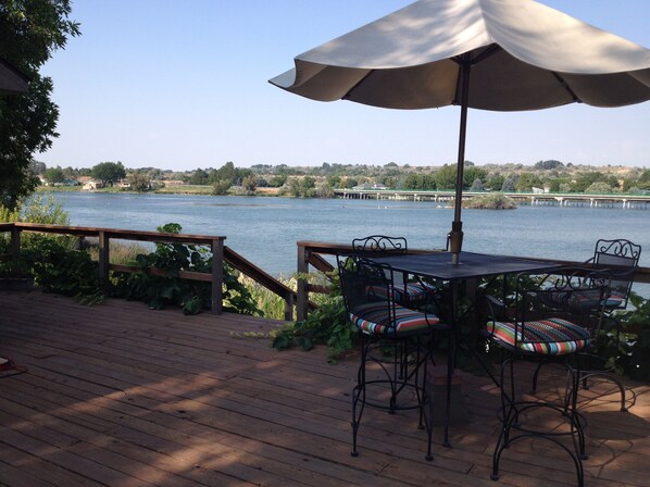 Relaxing dining or cocktails on our porch overlooking the Snake River.