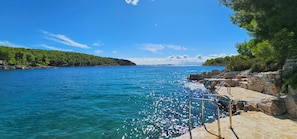 The villa's sun bathing deck on the beach in front of the villa