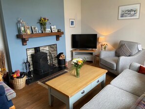 Lovely front living room with log burner. Great for a movie night! 