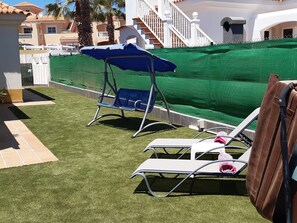 Sun loungers and privacy fencing.