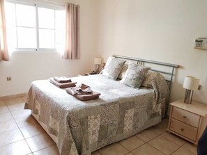 Master Bedroom with built in cupboards and AC