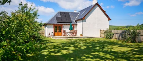 Fully enclosed back garden with sunny patio