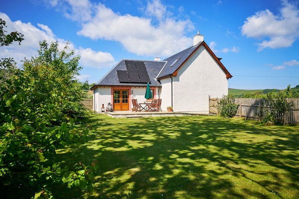 Fully enclosed back garden with sunny patio