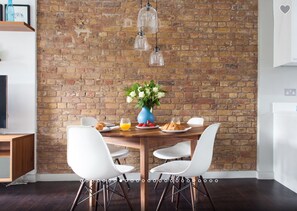 The original Victorian warehouse exposed brick wall.