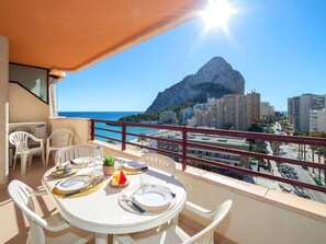Sky, Table, Furniture, Property, Chair, Building, Azure, Water, Tableware, Architecture